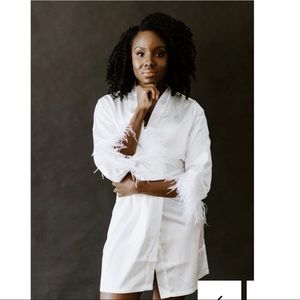 White robe with feathers